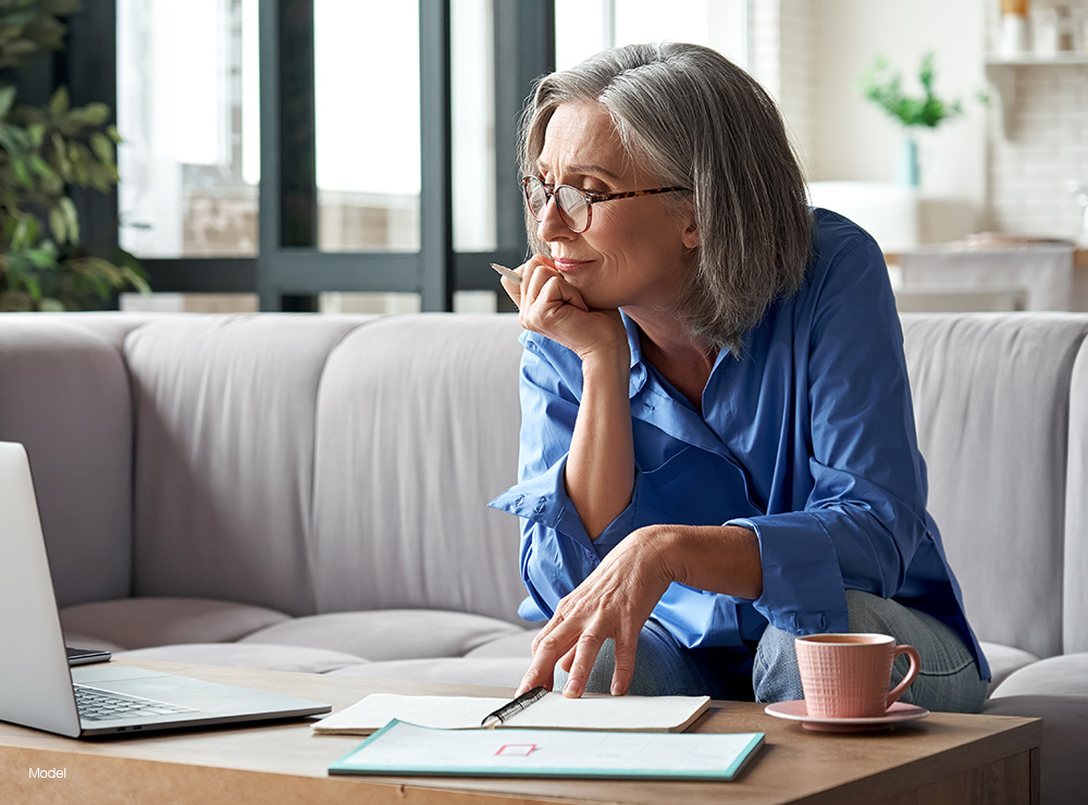 Mature Woman looking at a computer